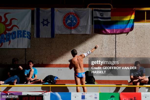 Swimmer puts clothing on during the swimming competition of the 2018 Gay Games edition at the Georges-Vallerey swimming pool in Paris on August 10,...