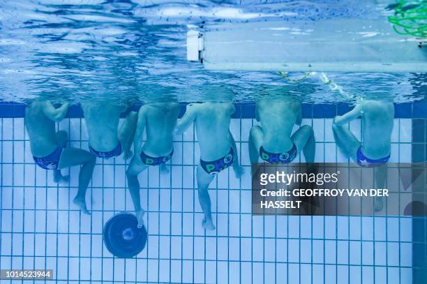 Athletes take part in the water polo competition of the 2018 Gay Games edition at the Georges-Vallerey swimming pool in Paris on August 10, 2018.