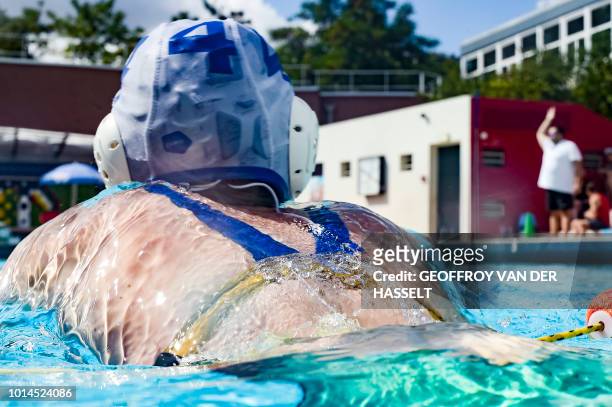 An athlete competes during the water polo competition of the 2018 Gay Games edition at Roger Le Gall swimming pool in Paris on August 10, 2018.