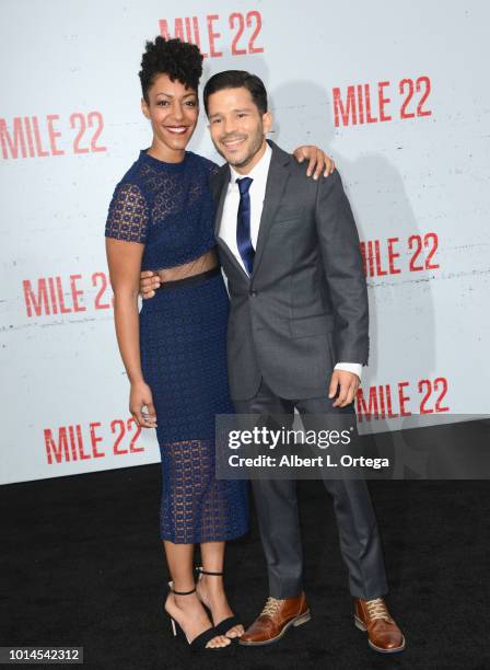 Actress Nemuna Ceesay and actor Carlo Alban arrive for the Premiere Of STX Films' "Mile 22" held at Westwood Village Theatre on August 9, 2018 in...