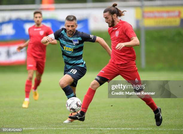 Vedad Ibisevic of Hertha BSC and Pavlos Laskaris of Aiginiakos FC during the test test match between Hertha BSC and Aiginiakos FC at the Athletic...