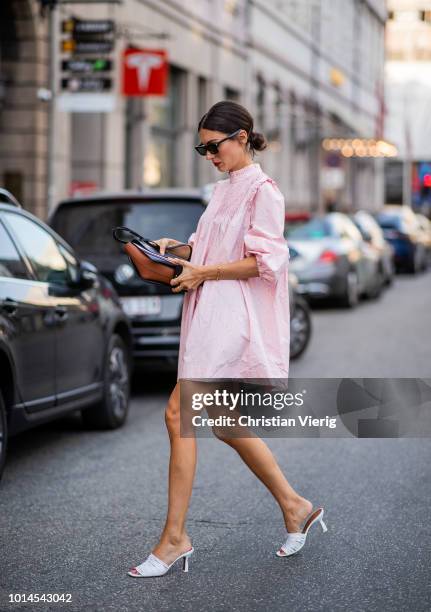 Diletta Bonaiuti wearing pink dress, white mules seen outside Baum und Pferdgarten during the Copenhagen Fashion Week Spring/Summer 2019 on August 9,...