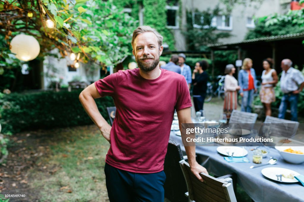 Portrait Of Young Man After Family Meal Outdoors