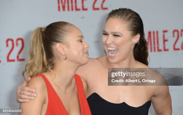 Julia De Mars and Ronda Rousey arrive for the Premiere Of STX Films' "Mile 22" held at Westwood Village Theatre on August 9, 2018 in Westwood,...