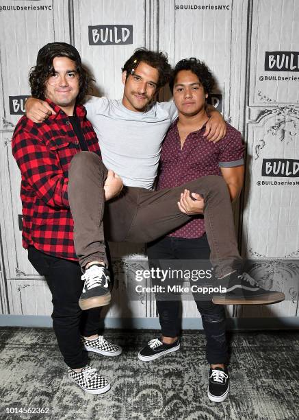 Nick Guzman, Tyler Posey, and Freddy Ramirez of the band PVMNTS pose for a photo during their visit to Build Studio on August 10, 2018 in New York...