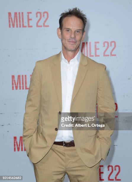 Director Peter Berg arrives for the Premiere Of STX Films' "Mile 22" held at Westwood Village Theatre on August 9, 2018 in Westwood, California.