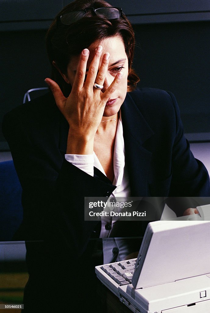 YOUNG WOMAN MANAGER IN HER OFFICE