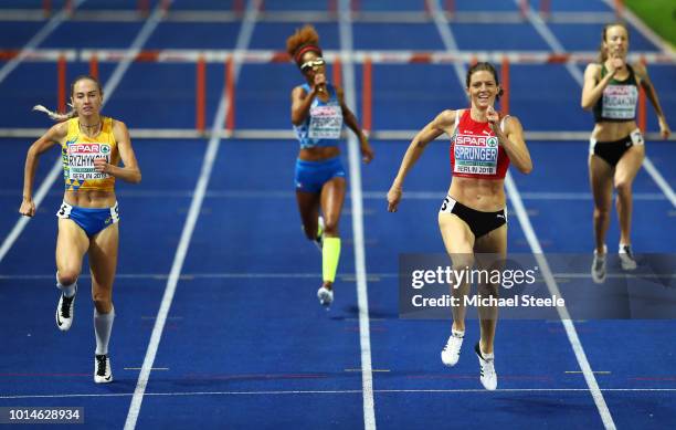 Lea Sprunger of Switzerland and Anna Ryzhykova of Ukraine compete in the Women's 400m Hurdles Final during day four of the 24th European Athletics...