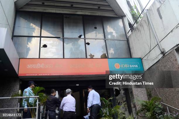 Maratha protesters pelted stone on IDBI bank, FC road after Maharashtra Bandh for Maratha reservation on August 9, 2018 in Pune, India. Quotas for...