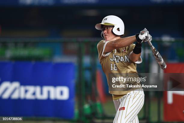 Yamato Fujita of Japan bats against Puerto Rico during their Playoff Round match at ZOZO Marine Stadium on day nine of the WBSC Women's Softball...