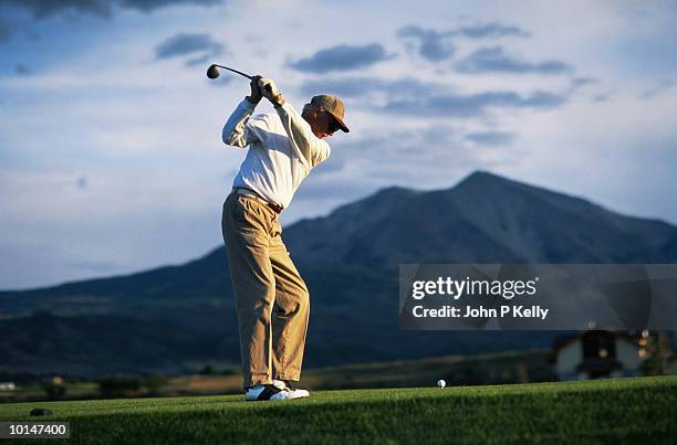 mature man playing golf western colorado - senior men golf stock pictures, royalty-free photos & images