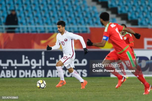 Akram Afif of Qatar runs with the ball during the AFC U23 Championship China 2018 Group A match between Oman and Qatar at Changzhou Sports Center on...