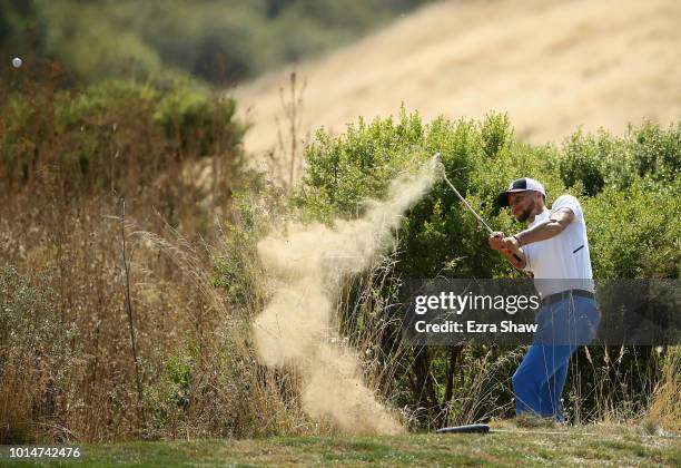 Player Stephen Curry of the Golden State Warriors hits out of the rough on the seventh hole during Round Two of the Ellie Mae Classic at TBC...