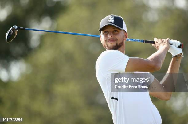 Player Stephen Curry of the Golden State Warriors tees off on the seventh hole during Round Two of the Ellie Mae Classic at TBC Stonebrae on August...