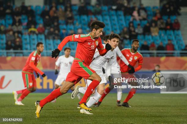 Muhsen Al Ghassani of Oman in action against Bassam Al Rawi of Qatar during the AFC U23 Championship China 2018 Group A match between Oman and Qatar...