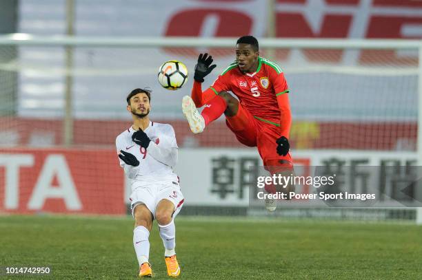 Thani Al Rushaidi of Oman in action against Meshaal Al-Shammeri of Qatar during the AFC U23 Championship China 2018 Group A match between Oman and...