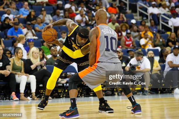 Stephen Jackson of the Killer 3s drives to the basket against Keith Bogans of 3's Company during week eight of the BIG3 three on three basketball...