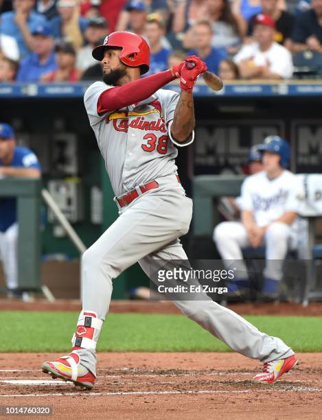 Jose Martinez of the St. Louis Cardinals hits a RBI single in the second inning against the Kansas City Royals at Kauffman Stadium on August 10, 2018...