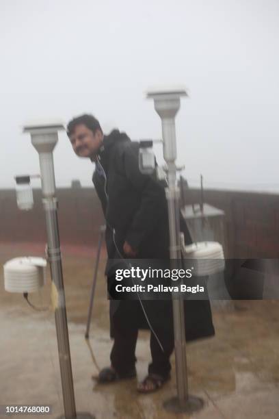 July 12, 2018. Scientists work on the rooftop of the High Altitude Clouds Physics Laboratory on July 12, 2018 in Mahabaleshwar, Maharshtra,India. The...