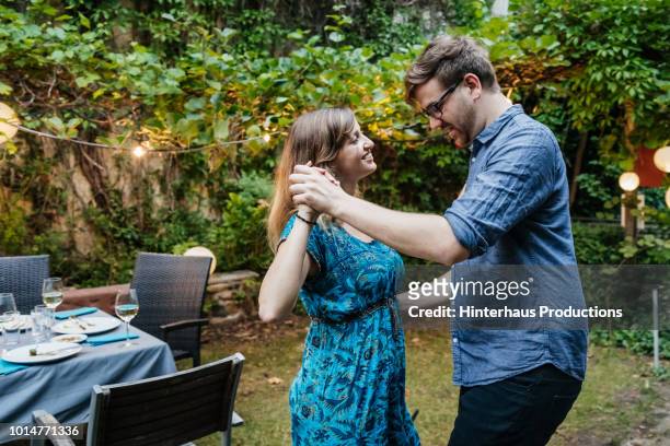 couple dancing at family bbq - couple dance stock pictures, royalty-free photos & images