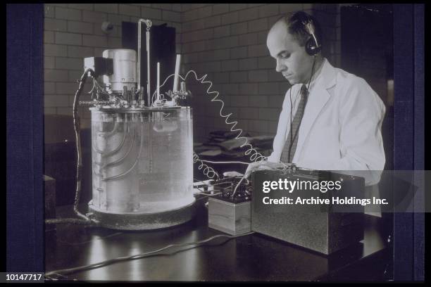 scientist performing experiment in lab, circa 1953 - the past stock pictures, royalty-free photos & images