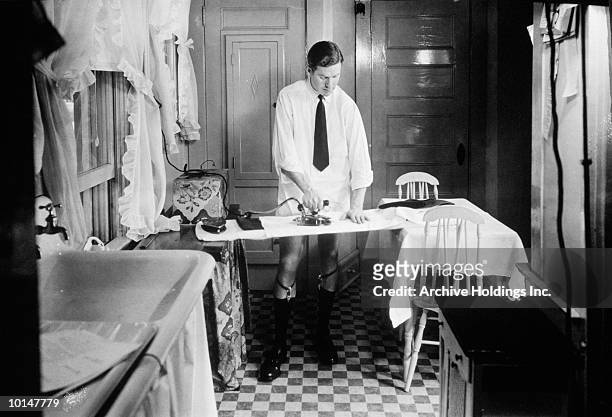 bachelor businessman ironing pants, 1938 - 1930s era stock pictures, royalty-free photos & images