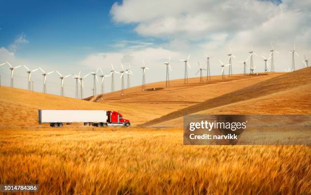 truck on the road going in the american countryside - green wheat stock pictures, royalty-free photos & images