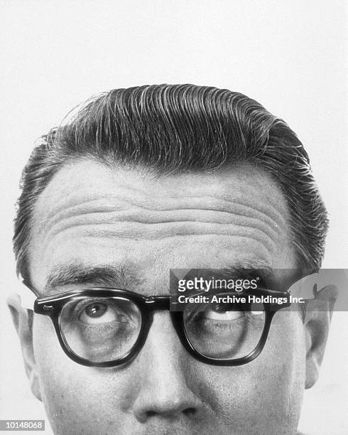 mans face from nose up, bespectacled - eye roll stock pictures, royalty-free photos & images