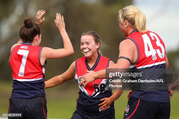 Maddison Wilson of Darebin celebrates kicking a goal during the round 14 VFLW match between Darebin and the Southern Saints at Bill Lawry Oval on...