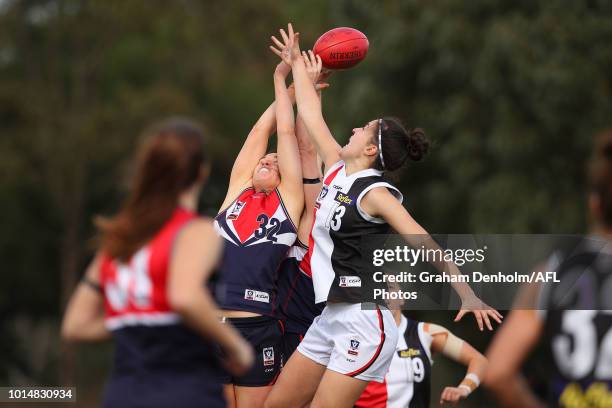 Gabrielle Colvin of Darebin and Courtney Munn of the Southern Saints compete in the air during the round 14 VFLW match between Darebin and the...
