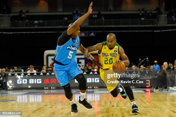 Andre Owens of the Ball Hogs drives to the basket against Cuttino Mobley of the Power during week eight of the BIG3 three on three basketball league...