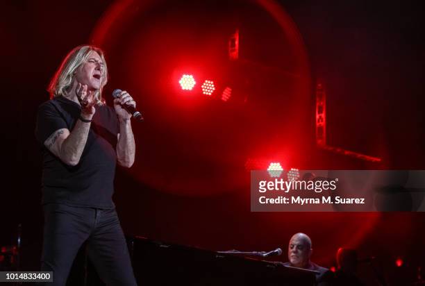 Joe Elliott of Def Leppard performs "Pour Some Sugar On Me" with Billy Joel at Fenway Park in Boston, Massachusetts. Billy Joel is the first artist...