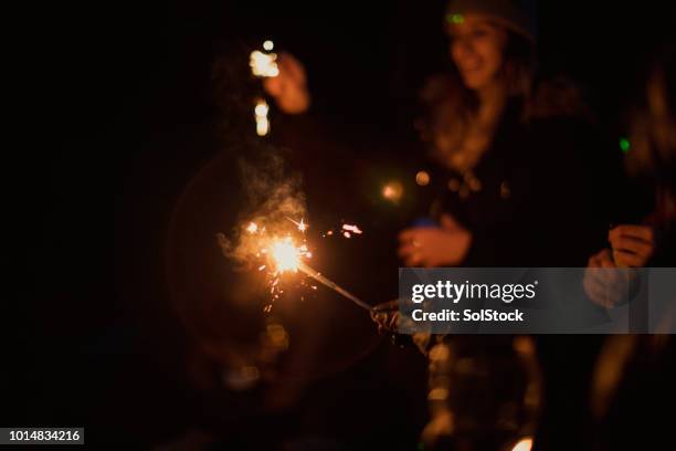 sparklers at night - guy fawkes day stock pictures, royalty-free photos & images