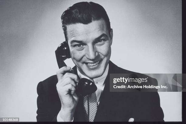 businessman on the phone, circa 1950s - landline phone imagens e fotografias de stock