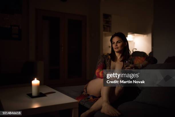 woman in sleepwear having a drink and relaxing - negligée stock-fotos und bilder