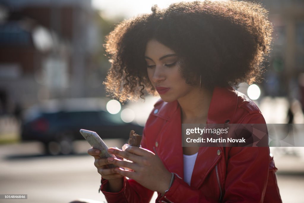 In connection - teen girl on phone in street