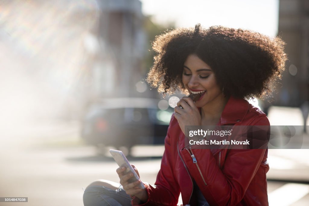 Always connected - teen girl on phone in street