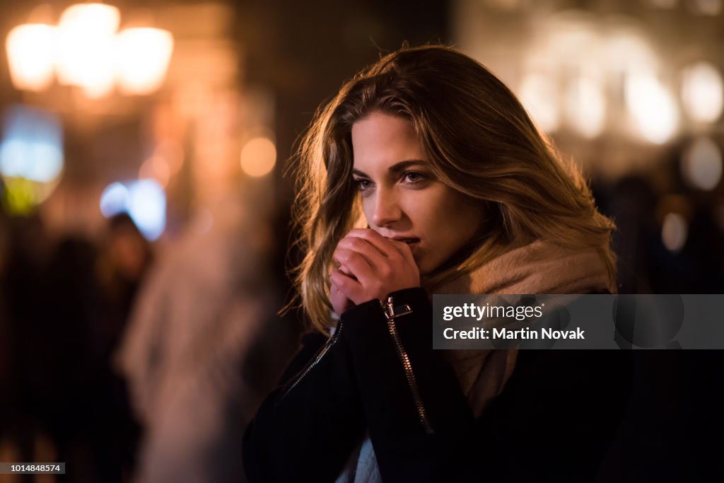 Woman shivering in a cold night
