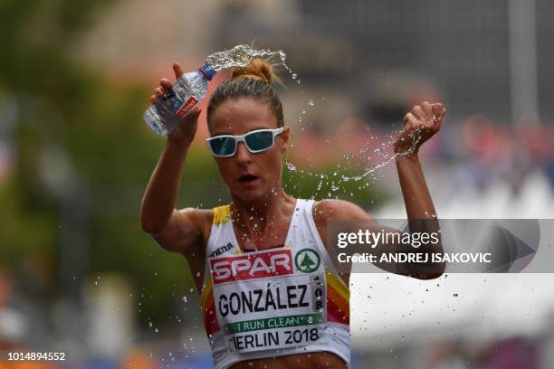 Spain's Raquel Gonzalez pours water on her head during the women's 20km walk final race during the European Athletics Championships in Berlin on...