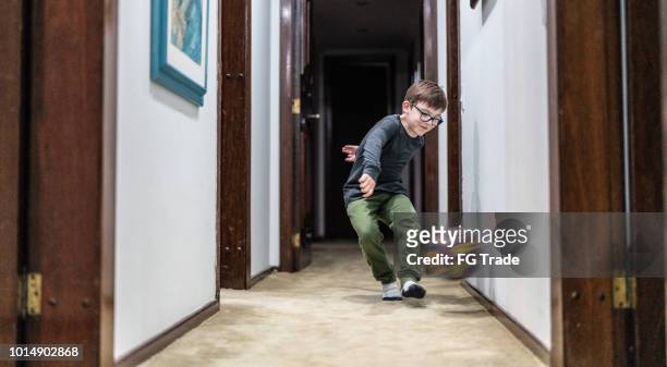 little boy playing with the ball at home - playing soccer stock pictures, royalty-free photos & images