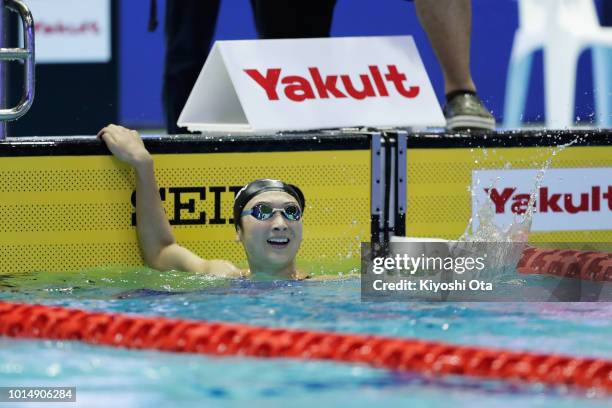 Rikako Ikee of Japan celebrates winning the gold medal after competing in the Women's 100m Butterfly Final on day three of the Pan Pacific Swimming...