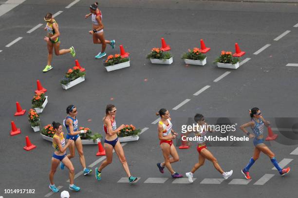 Antonella Palmisano of Italy sets the pace from eventual winner Maria Perez of Spain in the Women's 20km Race Walk during day five of the 24th...
