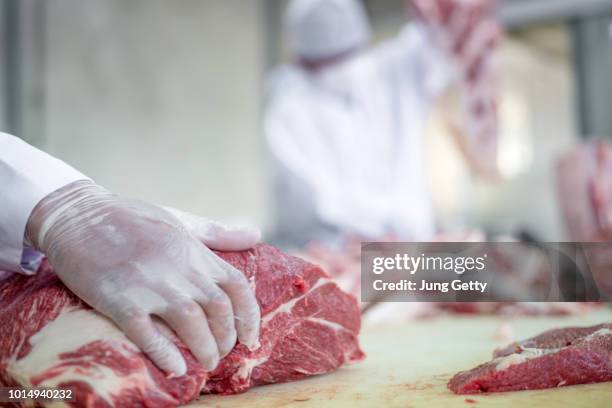 butcher cutting pork meat food industry concept - meat factory stock pictures, royalty-free photos & images