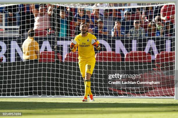 Goal keeper Gianluigi Donnarumma of AC Milan gives direction to his teammates during the International Champions Cup match against FC Barcelona at...