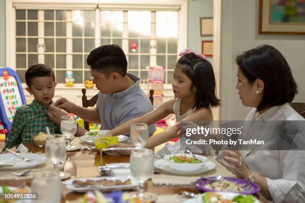 eating at home. - filipino family eating stock pictures, royalty-free photos & images