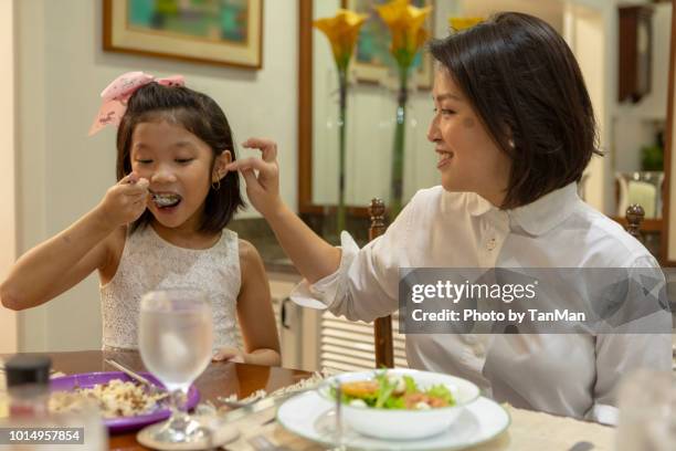 eating at home. - filipino family eating stock pictures, royalty-free photos & images