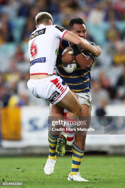 Siosaia Vave of the Eels is tackled by Gareth Widdop of the Dragons during the round 22 NRL match between the Parramatta Eels and the St George...