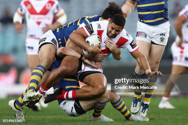 Nene Macdonald of the Dragons is tackled during the round 22 NRL match between the Parramatta Eels and the St George Illawarra Dragons at ANZ Stadium...