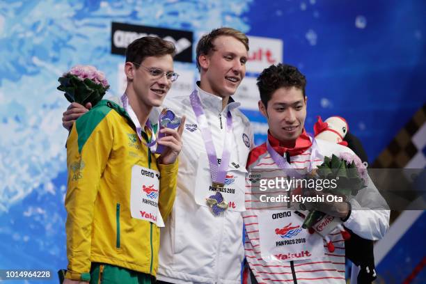 Silver medalist Mitchell Larkin of Australia, gold medalist Chase Kalisz of the United States and bronze medalist Kosuke Hagino of Japan pose for...