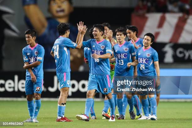 Players of Sagan Tosu celebrate after the J.League J1 match between Sagan Tosu and Urawa Red Diamonds at Best Amenity Stadium on August 11, 2018 in...